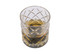 A crystal tumbler with a whisky drink inside, featuring a diamond-cut design and clear glass.