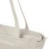 A light beige recycled zip tote with two long handles and a zip closure, featuring a logo.