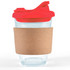A clear coffee cup with a red snap lid and a cork band around its middle. It has a logo.