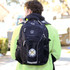 A black High Sierra Elite Fly-By 17" 42L computer backpack with a logo, worn by a person facing away.