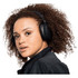 A pair of black Skullcandy Hesh ANC wireless headphones worn by a person with curly hair.