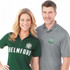 A green short sleeve polo shirt on a woman and a grey short sleeve polo shirt on a man, both with logos.