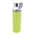 A drink bottle with a glass body and a bright green neoprene sleeve, featuring a silver cap and carrying loop.
