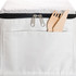 A white cooler bag features a zippered closure and wooden utensils peeking from a front pocket. It has a logo.