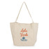 A beige tote bag with a logo and the text "Isla Verde" in orange and blue.