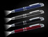 A set of four stylus pens in blue, black, silver, and red, each with a built-in torch. Features a logo on the pens.