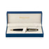 A metal ballpoint pen in black lacquer with gold trim, presented in a blue gift box with a white interior.