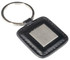 A square keyring with a metal centre and a black leather-look border, featuring a metal ring.