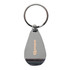 A silver keychain in a teardrop shape with a logo on one side.