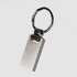 A silver keychain with a rectangular pendant and a circular ring, featuring a simple, sleek design.