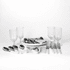 A picnic set features white-handled cutlery, glass tumblers, and serving platters on a white background.