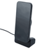 A sleek black wireless charger with a stand, holding a smartphone in an upright position.