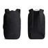 A black backpack with adjustable straps and a sleek design, featuring a logo and multiple zippered compartments.