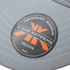 A grey cap featuring a circular logo with orange accents, labelled as "Falcon" by Trek Extreme.