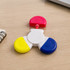 A Spinner Highlighter featuring red, yellow, and blue highlighting ends, connected by a white body.