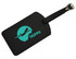 A black luggage tag featuring a turquoise logo of an airplane and the word "TRIPPO." It has a buckle strap.