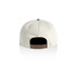 A two-tone cap featuring a cream front and a black back, with an adjustable strap and a logo.
