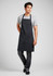 A black apron worn by a man, featuring a simple design and a front pocket, with a logo visible.