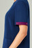 A navy blue scrub top with short sleeves featuring a maroon cuff detail and an attached logo.