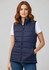 A navy woman's vest with a zip, featuring a quilted design and pockets, worn over a white t-shirt.