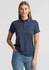 A women's short sleeve polo shirt in navy blue with a collar and a logo. The model is wearing it with jeans.