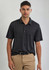 A men's short sleeve polo shirt in black with subtle stripes, featuring a collar and a logo on the chest.