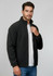 A black micro fleece jacket with a zip front and stand-up collar, worn by a model with a white t-shirt underneath.