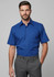 A blue short sleeve button-up shirt with a chest pocket, featured on a male model. The shirt has a logo on it.