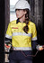 A yellow and navy women's safety shirt with reflective strips, worn with a hard hat and safety glasses.