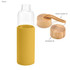 A drink bottle with a clear glass body and a mustard yellow silicone sleeve, featuring bamboo lids and a rope handle.