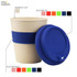 A reusable bamboo coffee cup with a blue silicone lid and band, featuring an integrated logo.