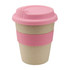 A reusable coffee cup in a natural beige colour with a pink silicone lid and band. It features a logo.