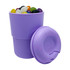 A reusable coffee cup in light purple, filled with colourful jelly beans, accompanied by a matching lid.