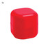 A red cube-shaped container of lip balm with a smooth, glossy finish. It has a logo on the surface.