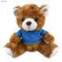 A plush teddy bear in brown, wearing a blue shirt with a white belly and paws. It has a cute, friendly expression.