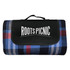 A picnic blanket featuring a navy, red, and grey plaid pattern, with a black carrying handle and logo.