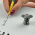 A grey koala-shaped pencil-top eraser next to a yellow pencil, with the word "Smile" written on lined paper.