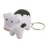 A white and black cow-shaped key ring with a metal keychain. It features a cartoonish design.