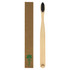 A bamboo toothbrush with a wooden handle and black bristles, packaged in a brown cardboard box with a logo.