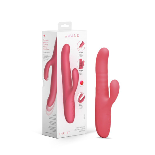 Le Wand Thrust thrusting rabbit vibrator in coral shown beside its retail box