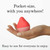 iroha Mini massager in red and pink held in an open palm to show its pocket size