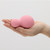 iroha YUKI Nadeshiko Pink vibrator held in an open hand to show its size