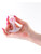 NS Novelties Cosmic Glams Small Pink anal plug with pink glass marble held in hand