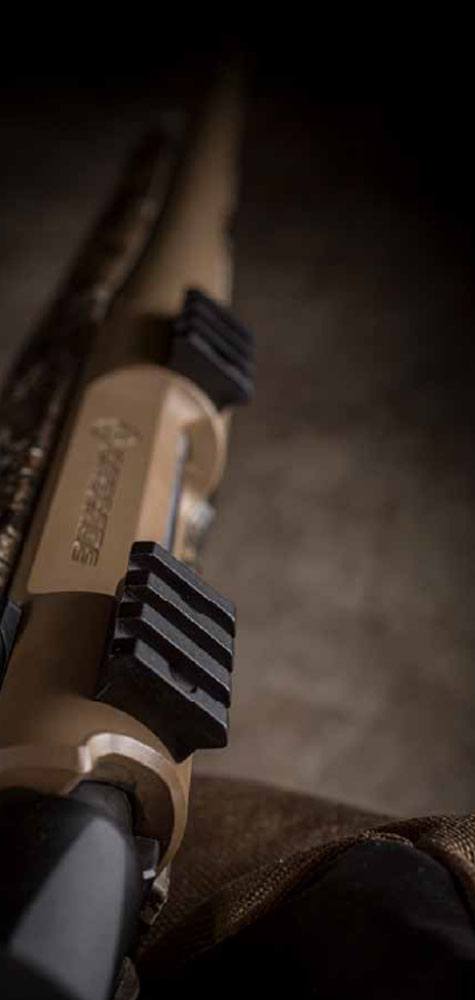 Top of rifle with mounting brackets in focus.