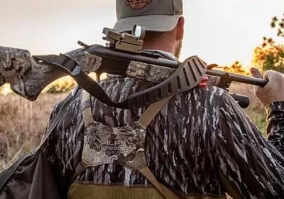 Man with gun on shoulder.