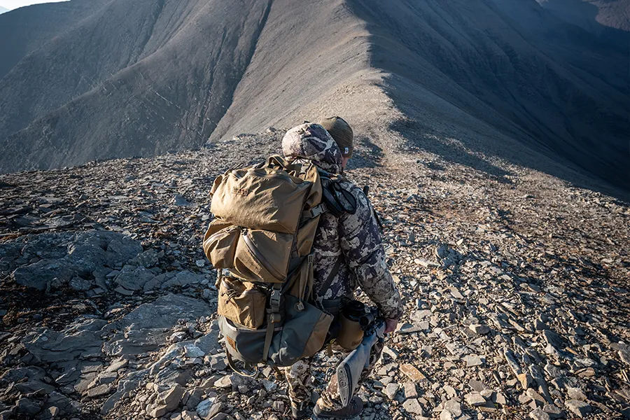 Man in snow camo shooting Bergara rifle.