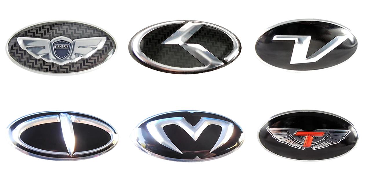 Oval overlay cover-up steering wheel emblems for Hyundai models Genesis Santa Fe Sonata Elantra Accent Veloster Tucson Creta Ioniq steering wheel emblems Wing steering wheel emblem Kia K steering wheel emblem Veloster V steering wheel emblem Tomato A&P T logo steering wheel emblem M&S M meccamachine mecca machine & Style steering wheel emblem Tomato A&P T-wing steering wheel emblem