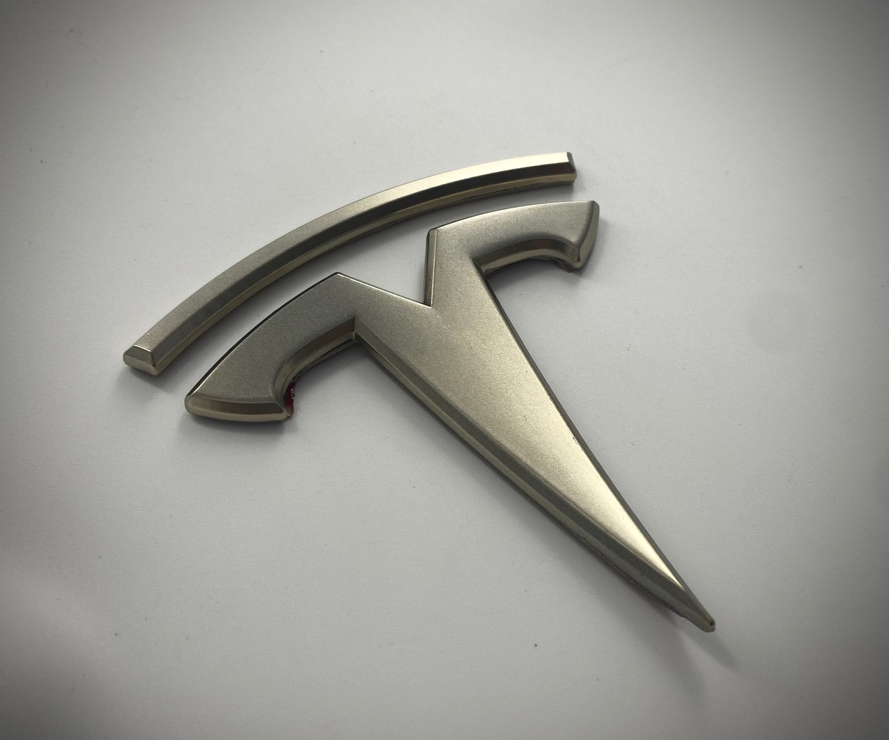 champagne gold tesla t badge