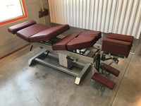 Air Drop Elevation Chiropractic adjusting table viewed from right hand side with options raised color oxblood.