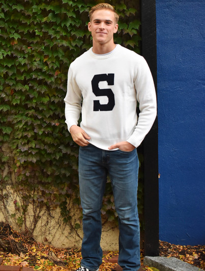 Alan Paine Varsity S Sweater in Ivory, a classic collegiate sweater with a large black S.